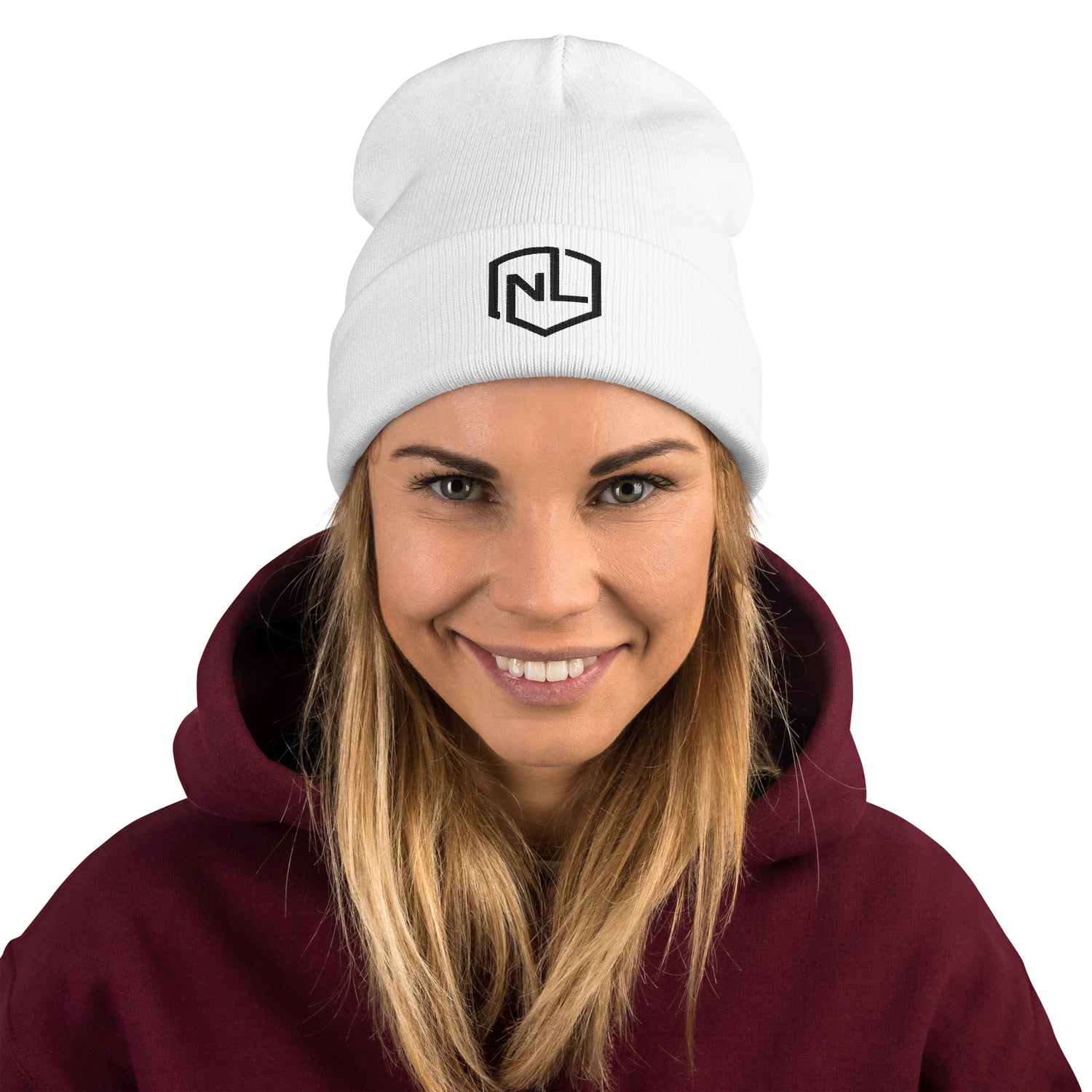 A woman in a white beanie and hoodie, showcasing a form-fitting, embroidered NEVR LOOZ hat - Beanie. Made of 60% cotton, 40% acrylic for cozy warmth. On-demand production for sustainability.